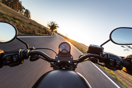 the view over the handlebars of a speeding motorcycle